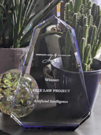 A picture of the award in front of some plants and decorations.